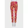 Pink cropped trousers with a print