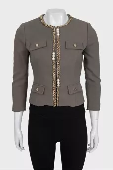 Green jacket with a gold chain