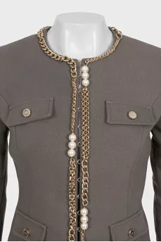 Green jacket with a gold chain