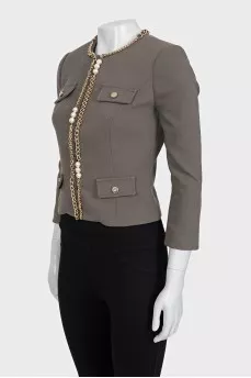 Green jacket with a gold chain