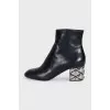 Leather ankle boots with silver heels