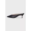 Black leather mules with metal insert