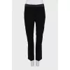 Black trousers with satin inserts on the sides