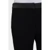 Black trousers with satin inserts on the sides