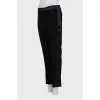 Black trousers with satin inserts on the sides