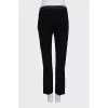 Black trousers with satin inserts on the sides