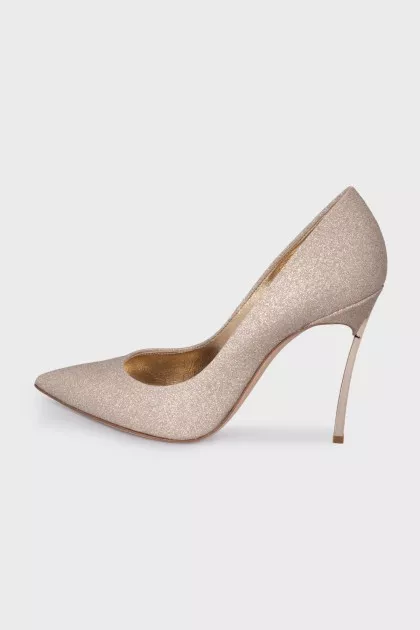 Golden shoes decorated with glitter