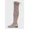 Gray suede over-the-knee boots with lace-up closures