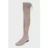 Gray suede over-the-knee boots with lace-up closures