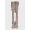 Gray suede over-the-knee boots with lace-up closures