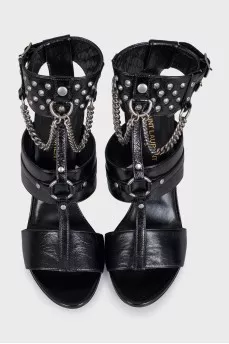 Black leather sandals decorated with studs