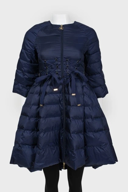 The dark blue jacket is flared up