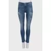 Mid-rise skinny jeans with distressing