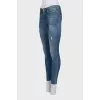 Mid-rise skinny jeans with distressing