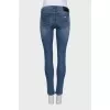 Mid-rise skinny jeans with distressing