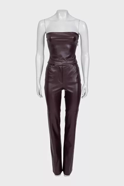 A suit consisting of a crop top and straight-leg trousers