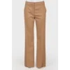 Brown trousers of straight cut from a camel wool