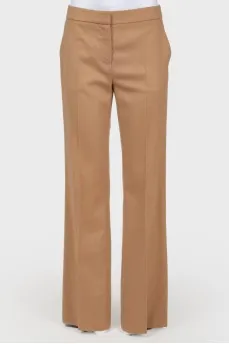 Brown trousers of straight cut from a camel wool