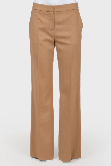 Brown trousers of straight cut from a camel wool