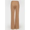 Brown trousers of straight cut from a camel wool