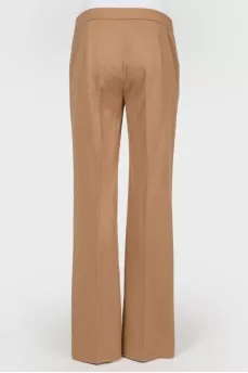 Brown trousers of straight cut from a camel wool