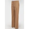 Brown trousers of straight cut from a camel wool