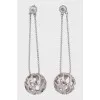 Silver earrings decorated with crystals