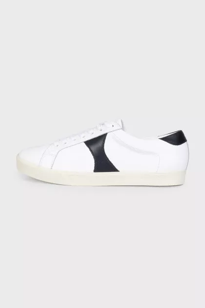 Sneakers with black inserts and a tag