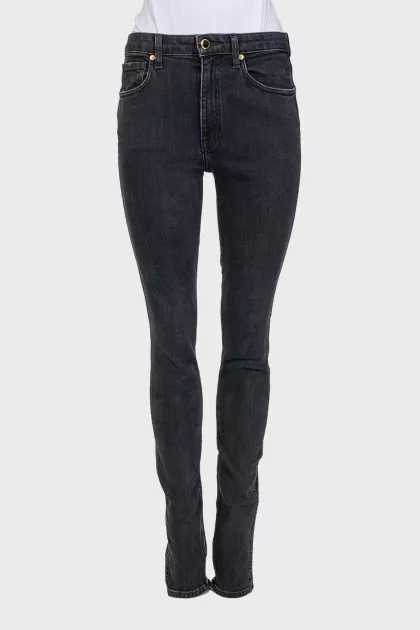 Mid-rise tapered jeans with zippers at the bottom