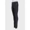 Mid-rise tapered jeans with zippers at the bottom