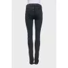 Mid-rise tapered jeans with zippers at the bottom