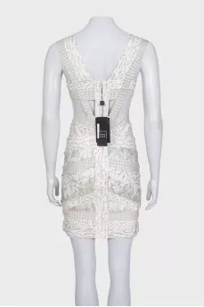 Cocktail dress with cutout waist and tag