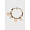 Gold chain bracelet with pendants