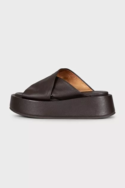 Brown leather flip-flops with high soles
