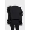 Black cropped jacket decorated with feathers
