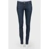 Dark-blue jeans narrowed on low landing