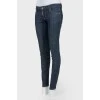Dark-blue jeans narrowed on low landing