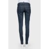 Dark-blue jeans narrowed on low landing