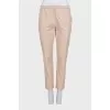 Tapered trousers with elastic