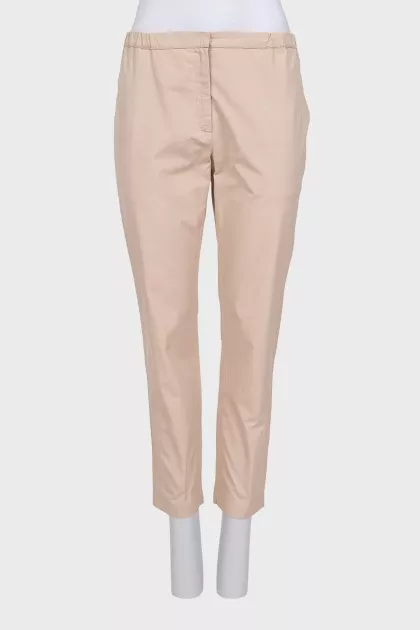 Tapered trousers with elastic