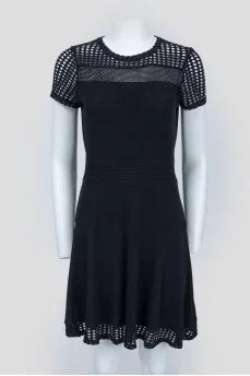 Black dress with perforated inserts