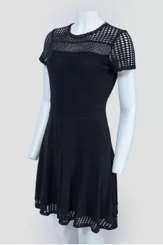 Black dress with perforated inserts