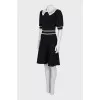 Black fitted dress with lace trim