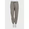Brown sweatpants with a signature print