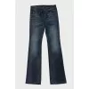 Blue flared jeans with a chain on the pocket