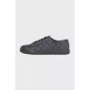 Men's black sneakers with a signature print
