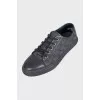 Men's black sneakers with a signature print