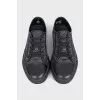 Men's black sneakers with a signature print