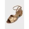Gold-color leather sandals decorated with crystals