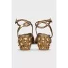 Gold-color leather sandals decorated with crystals